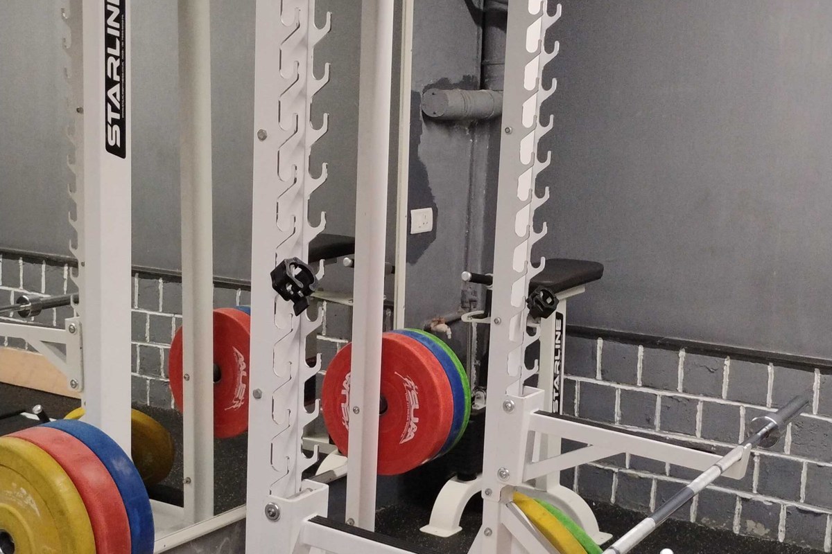 Starline Olympic Squat Cage with Color Coded Bumper Plates