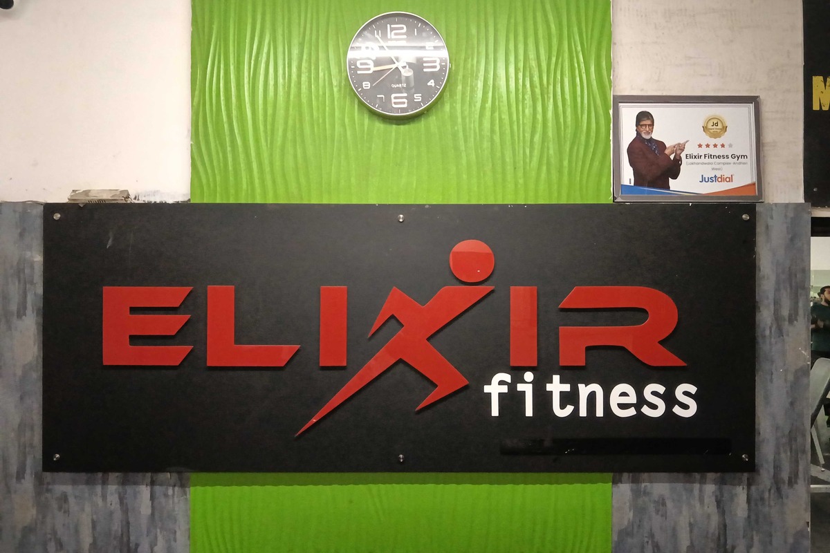 Elixir Fitness Reception Signboard with Green Wave Feature Wall