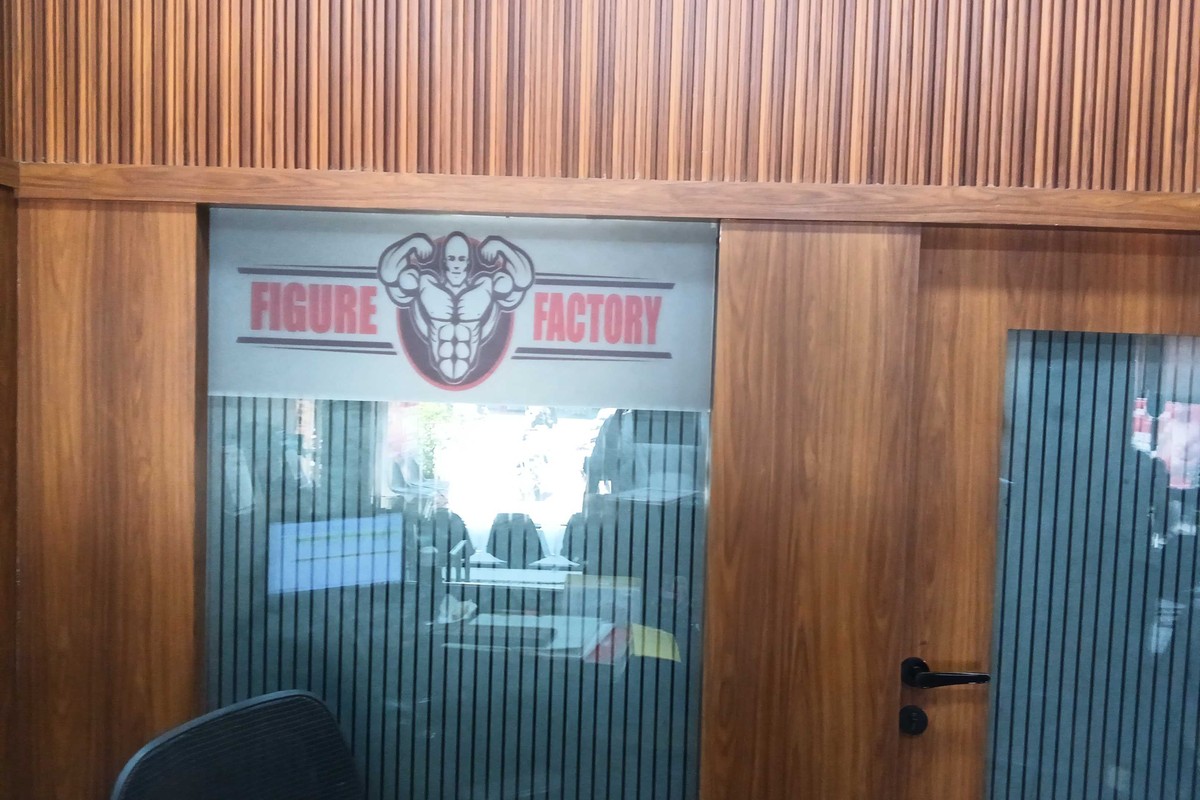 Figure Factory Glass Consultation Office with Wood Paneling