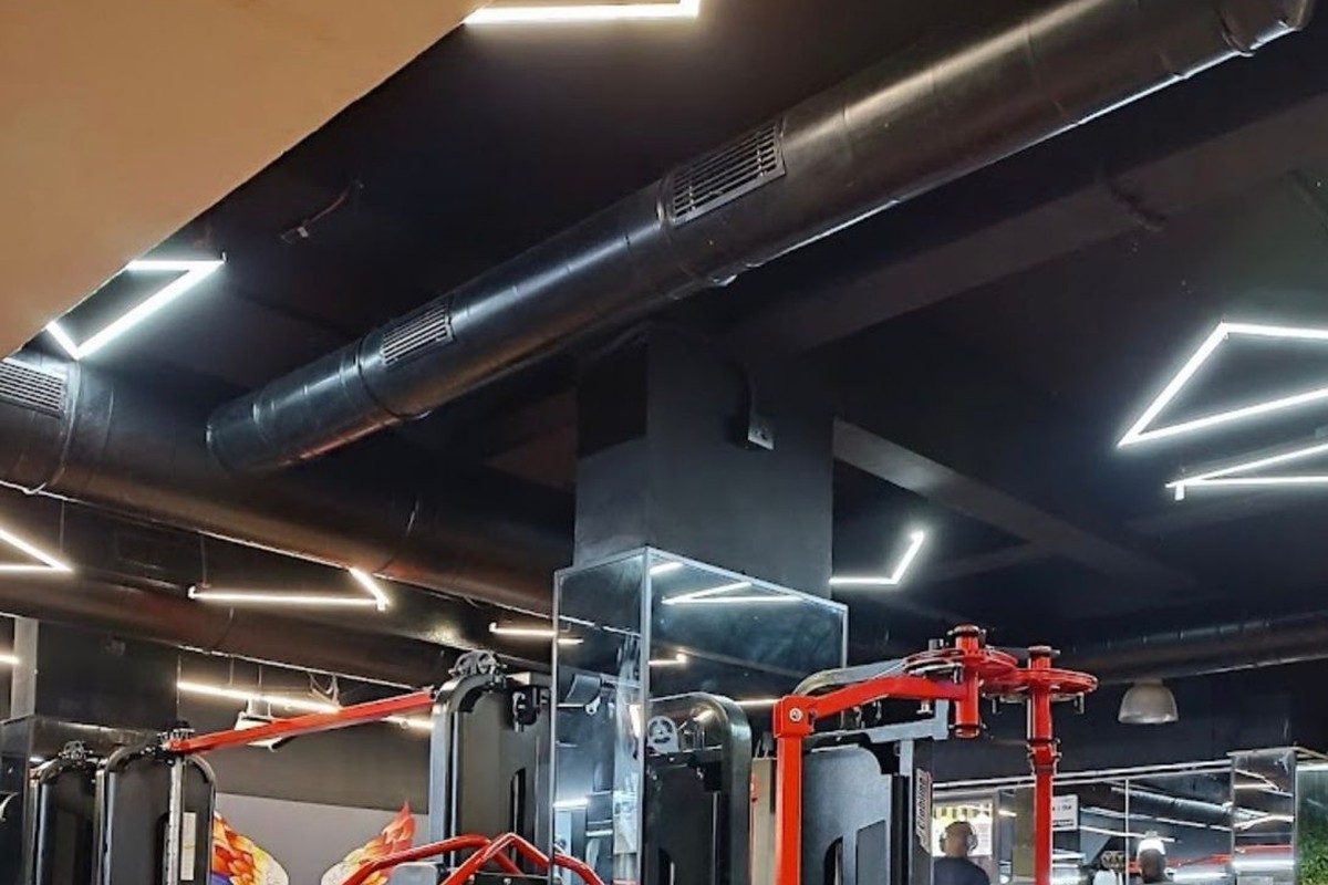 Selectorized Lat Pulldowns and Geometric LED Triangle Lights
