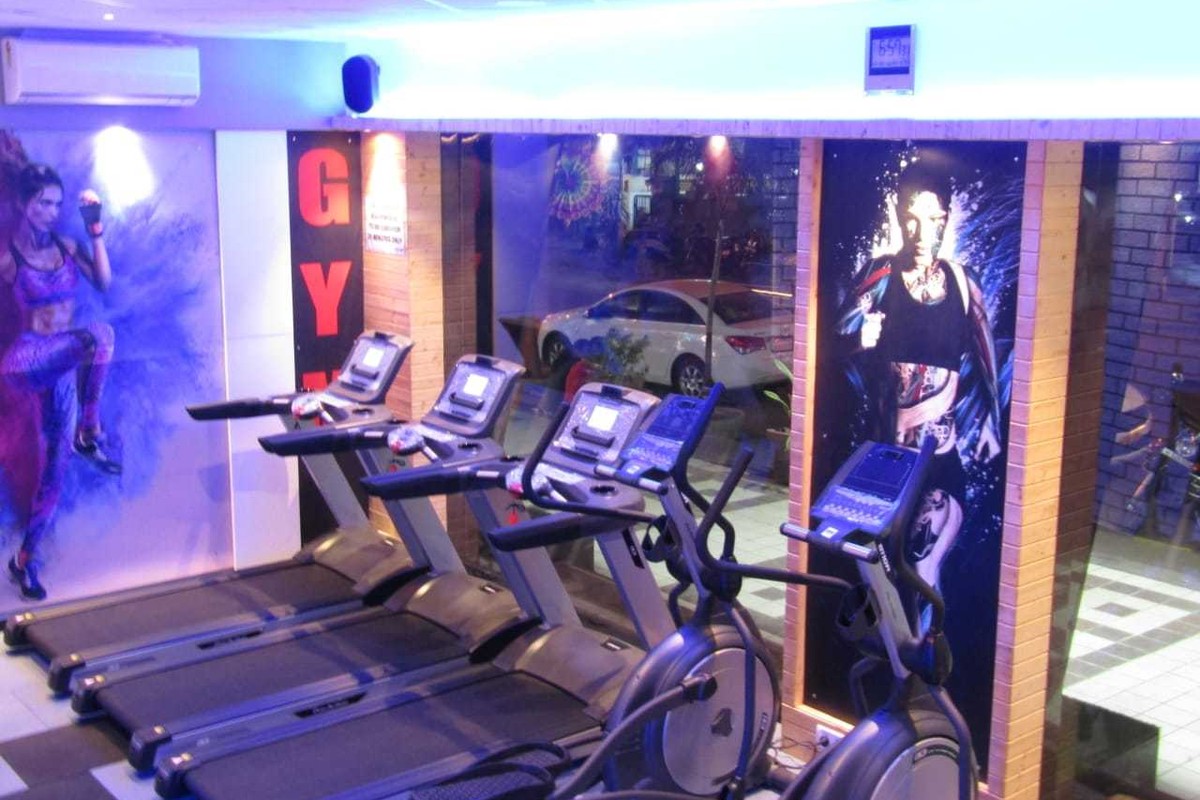 Cardio Deck Overlooking Member Outside Vehicle Parking Through Glass Windows