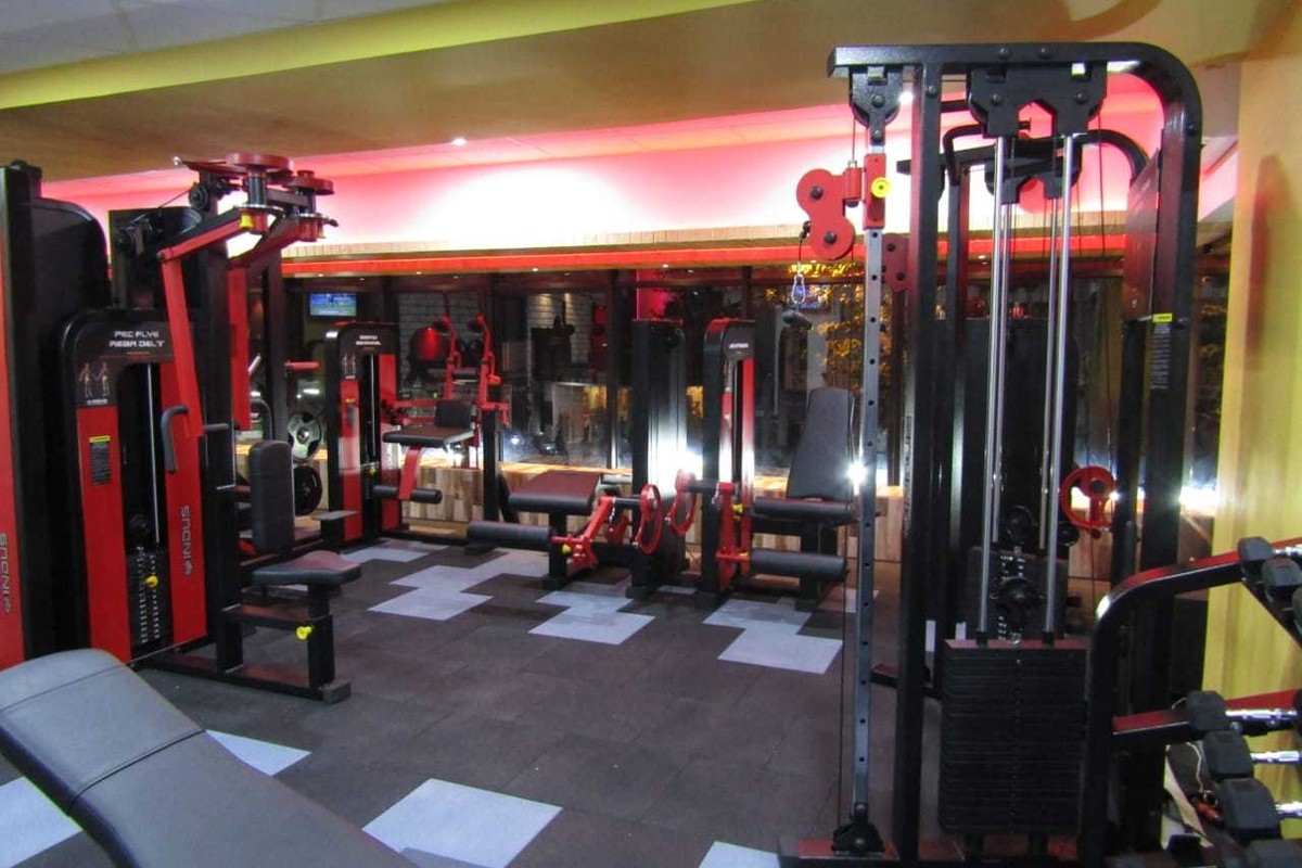 Dual Cable Crossover Tower, Leg Curl and Incline Benches