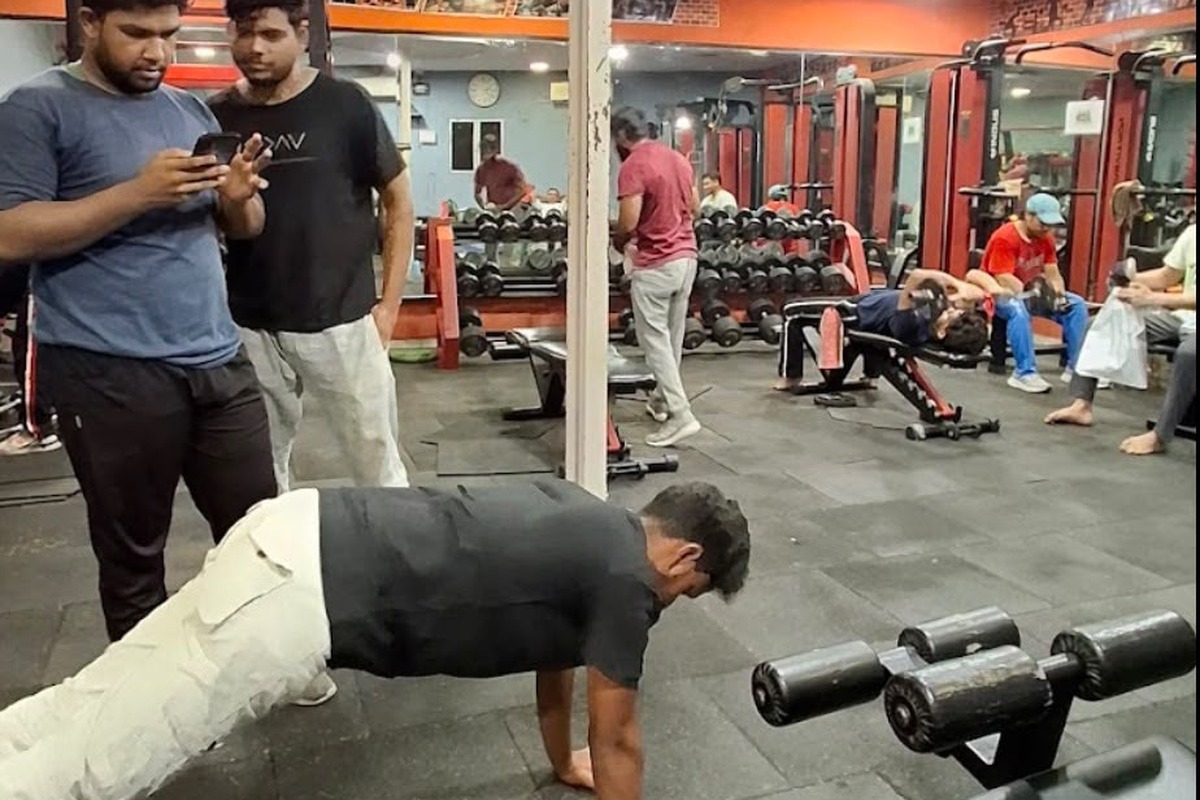 Gym Members Training on Floor, Free Weights and Bodyweight Exercises