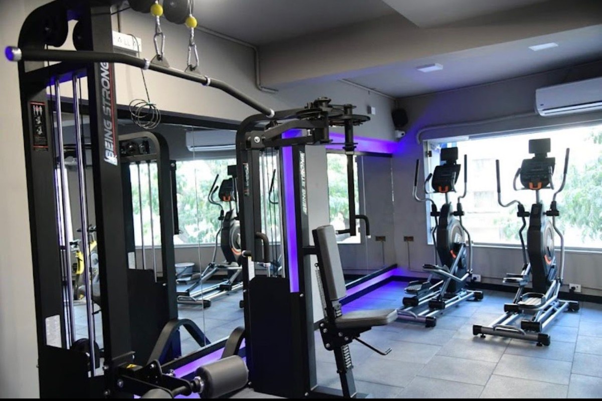 Lat Pulldown Station, Pec Deck and Ellipticals with Purple LED Lighting