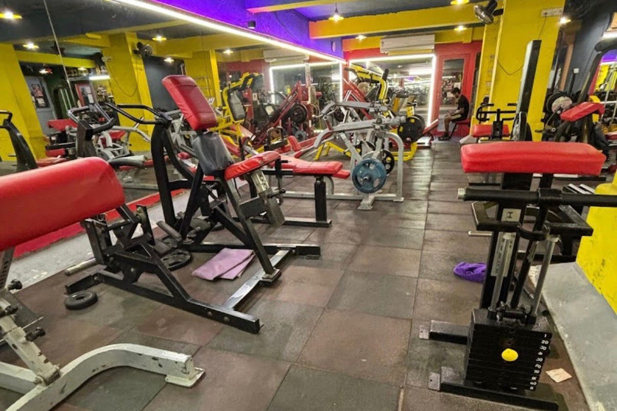 Main Strength Training Floor with Preacher Bench and Purple LED Coves