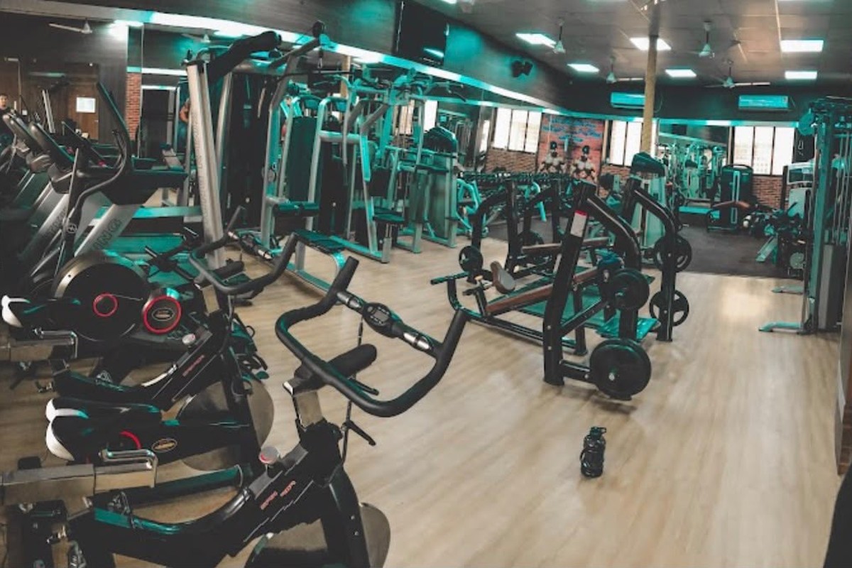 Cardio Deck with Upright Spin Cycles and Lat Pulldown Machinery