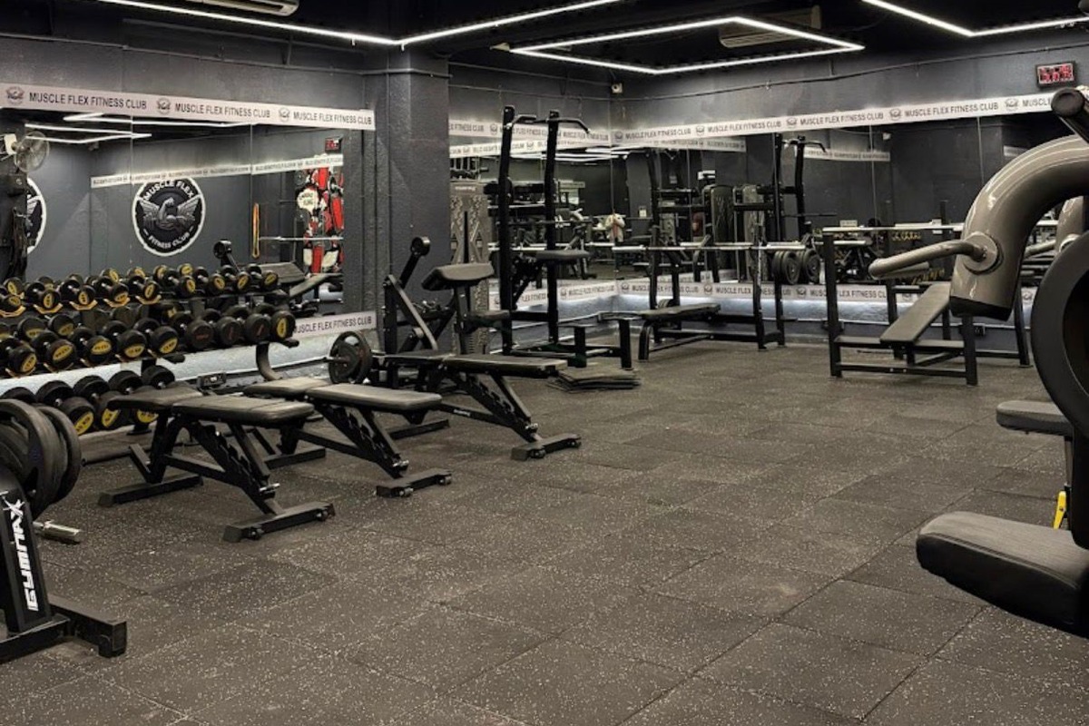 Heavy Round Urethane Dumbbells on Multi-Tier Racks and Commercial Incline Benches