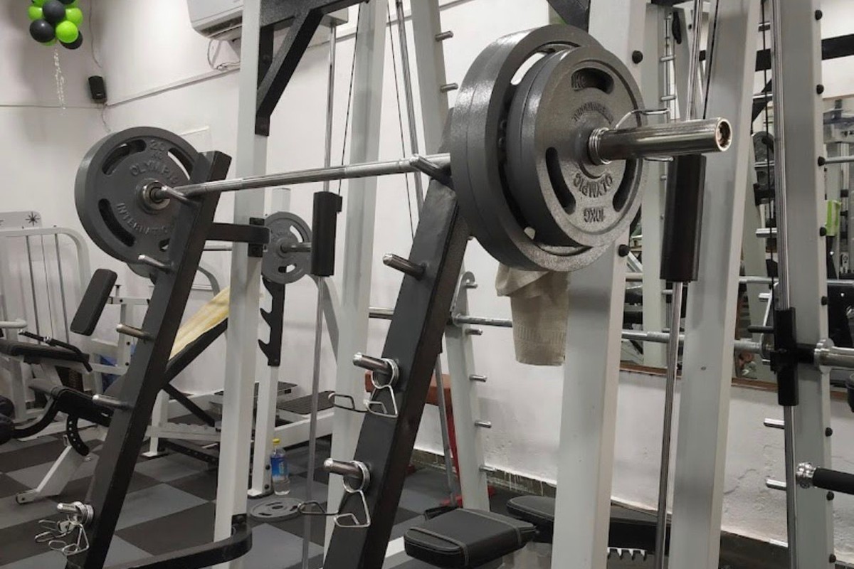 Olympic Squat Rack with Heavy Iron Weight Plates and Smith Machine