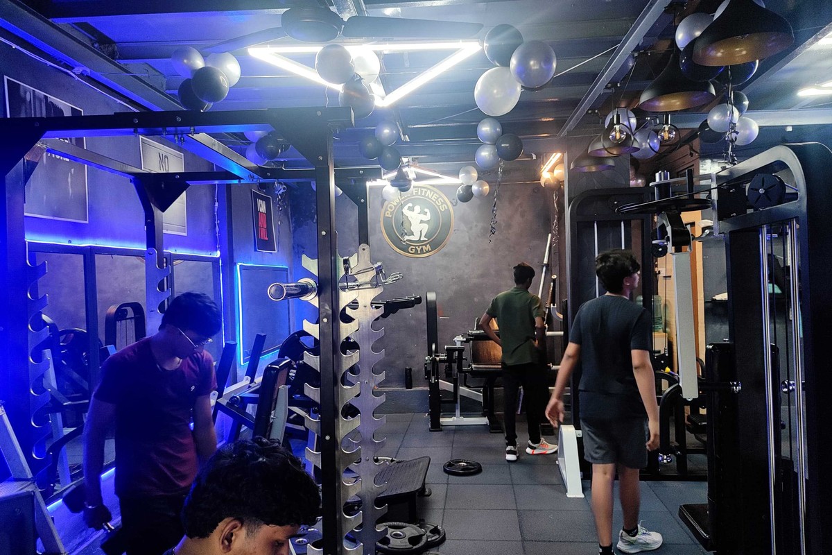 Wide Training Floor View with Squat Racks and Dumbbells