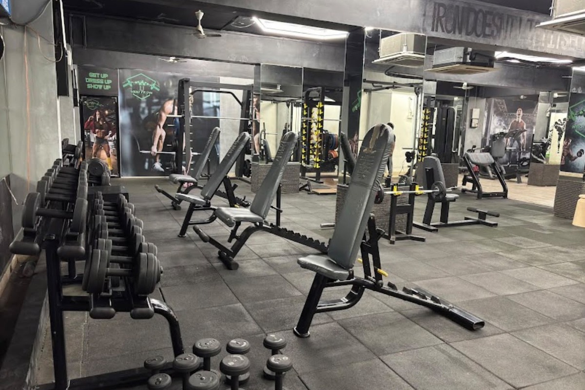 Squat Fit Gym Main Training Floor with Incline Benches, Dumbbells and Squat Cage