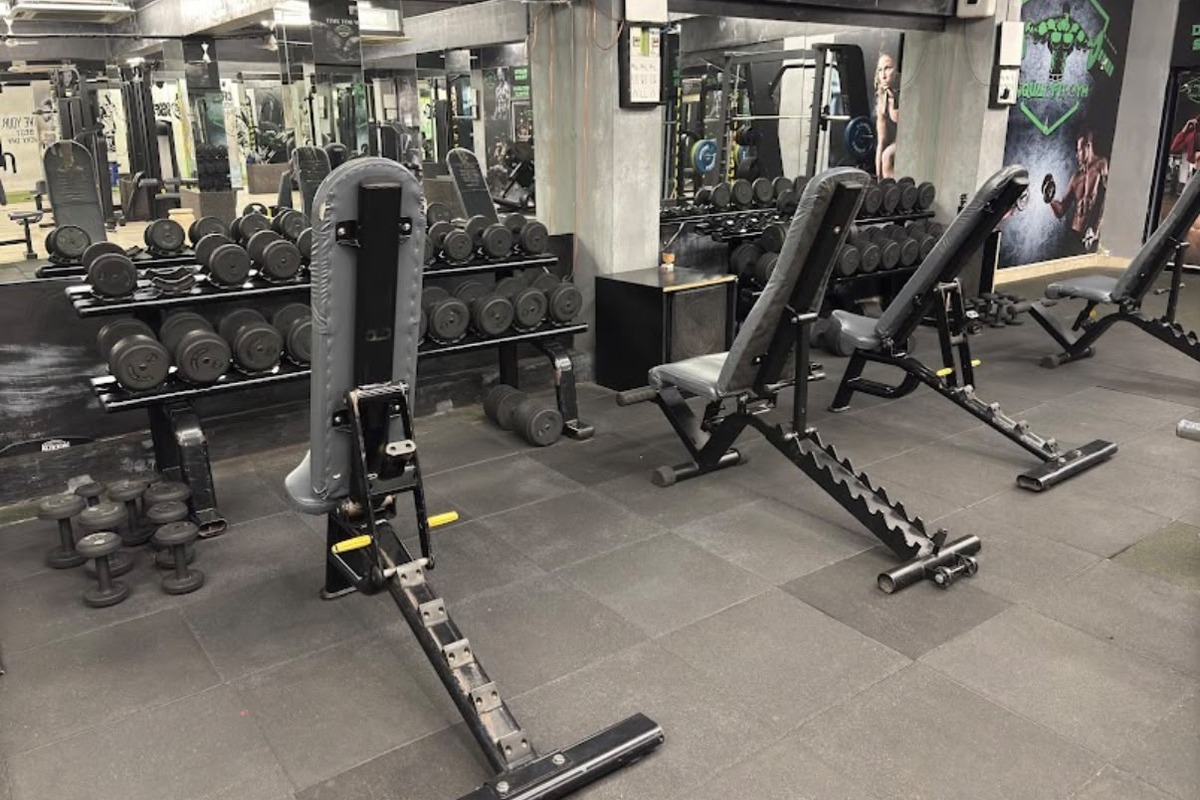 Urethane Dumbbell Bay with Mirrors and Squat Fit Gym Branding