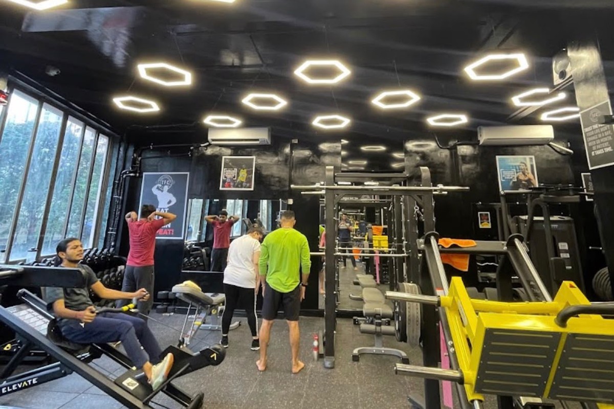 TFC Plate-Loaded Yellow Leg Press & Squat Zone