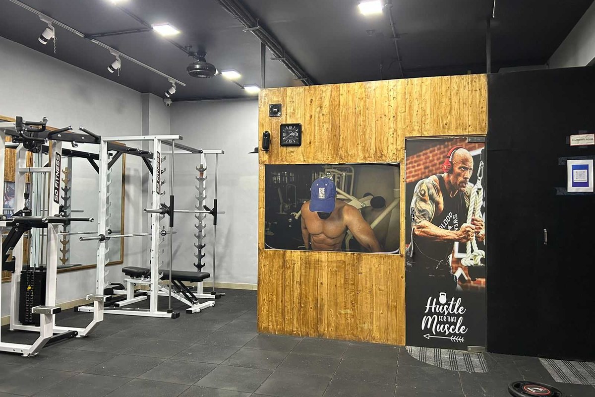Olympic Power Squat Cage and Incline Press with Motivational Murals