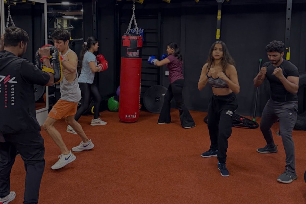 MMA Combat Arena with Coach and Heavy Striking Bags at The Strength Company