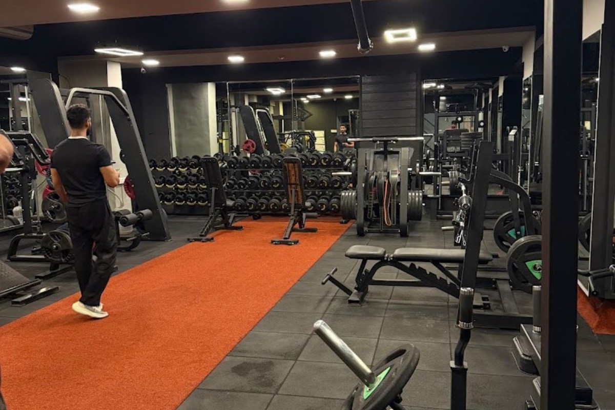 Red Turf Sprint Track, Dumbbell Racks and Cable Lat Station