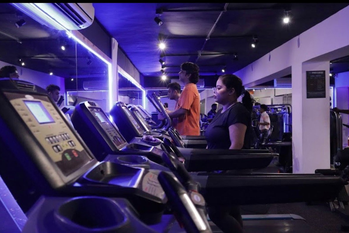 Motorized Treadmills and Ellipticals with Blue Backlit Mirrors