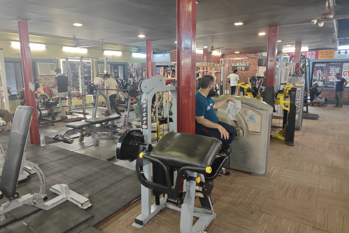 Workout Gym Main Training Floor, Preacher Curl and Brick Wall Sign